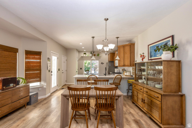11751 Lake Run Road South Jordan, UT 84009 - Photo 13 of 38 Open-concept living space featuring wood-finish flooring, recessed lighting, and a kitchen with light wood cabinetry
