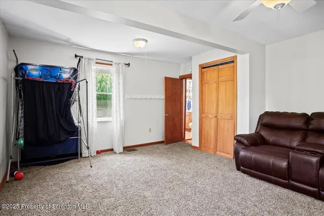 a view of livingroom with furniture and a window