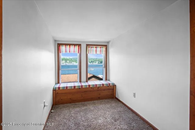 a room with a bed and a window