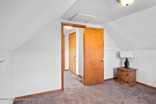 a bedroom with a bed and a table in it