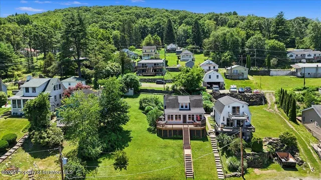 a balcony with lots of residential buildings and garden view