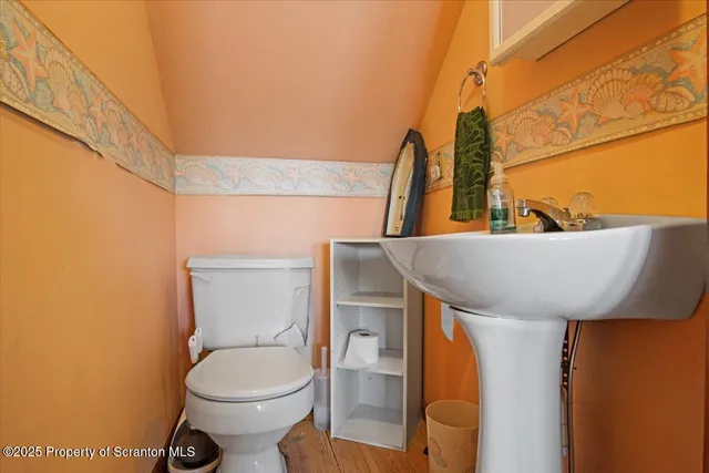 a bathroom with a toilet and shower