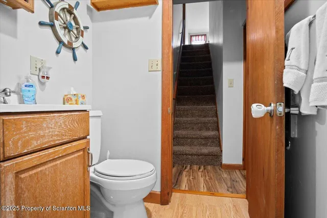 a view of a balcony with wooden floor and outdoor seating