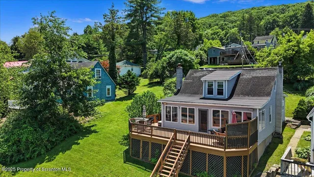 aerial view of a house with a yard