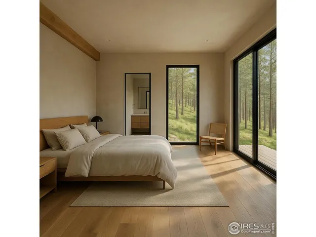 a bedroom with a bed and large windows