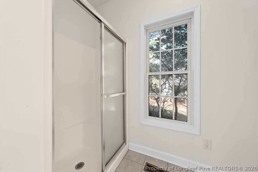 60 Spring Lake Drive Pinehurst, NC 28374 - Photo 20 of 42 a bathroom with a window and a shower