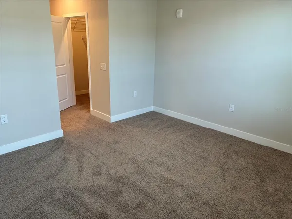 an empty room with a bathroom