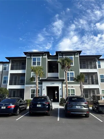 a view of a car parked in front of a building