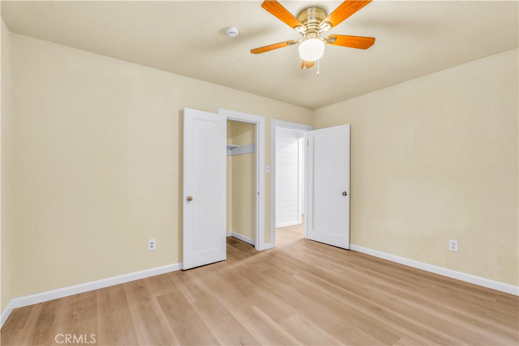 15905 Kugelman Street Lower Lake, CA 95457 - Photo 47 of 75 a view of a room with a ceiling fan and wooden floor
