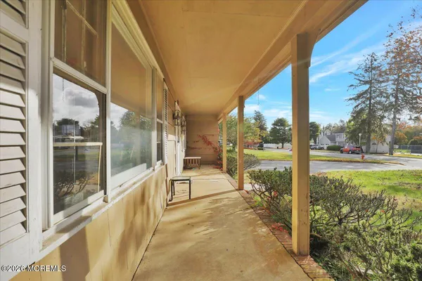 a view of a porch and a yard