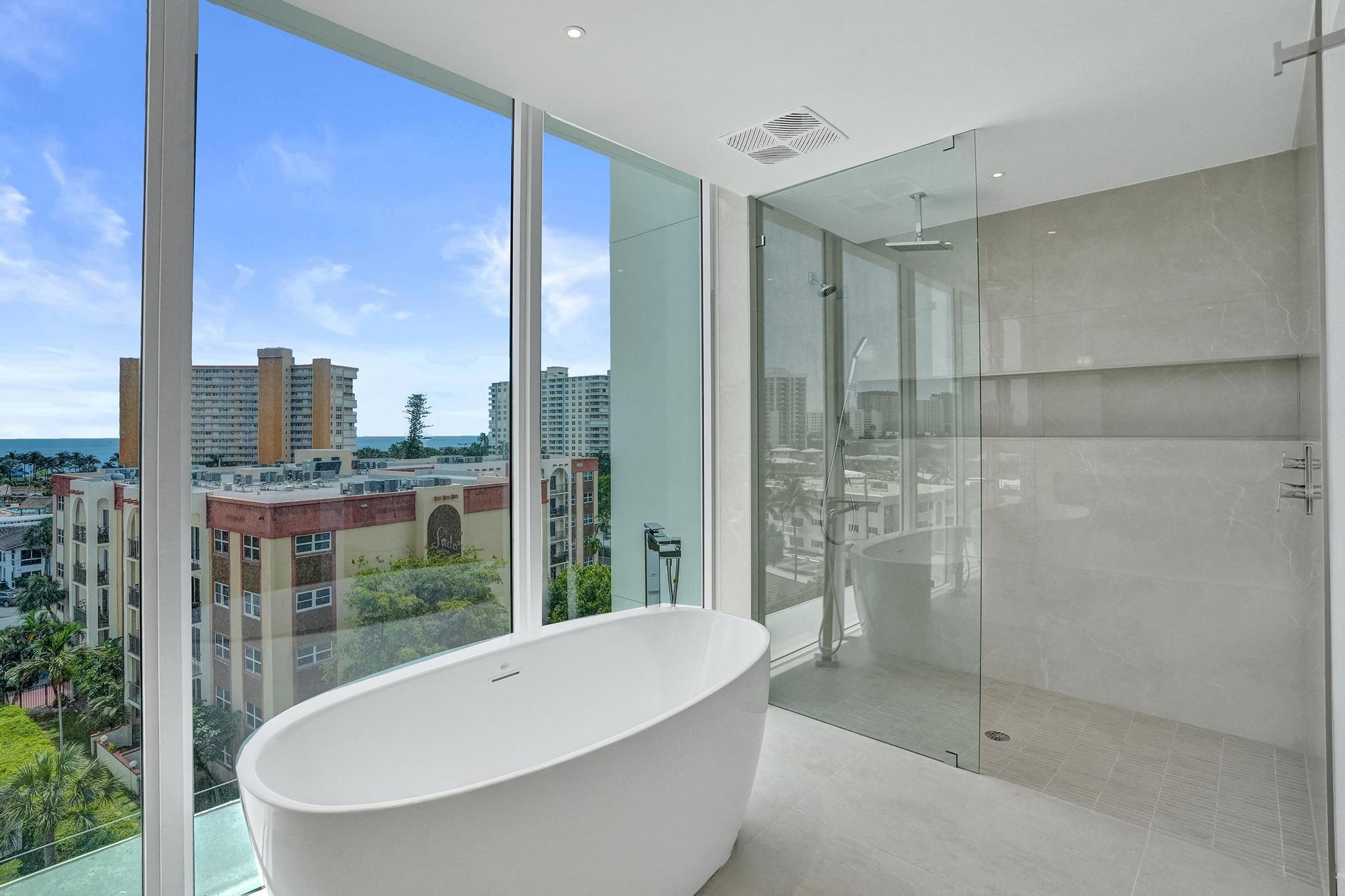 407 North Riverside Drive, Unit 605 Pompano Beach, FL 33062 - Photo 26 of 93 a bathroom with a bathtub and shower