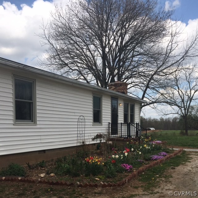 1794 Taylor Road Crozier, VA 23039 - Photo 17 of 20 a front view of house with yard and green space