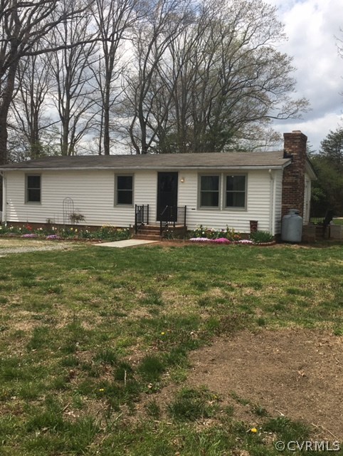 1794 Taylor Road Crozier, VA 23039 - Photo 4 of 20 a front view of house with yard and trees