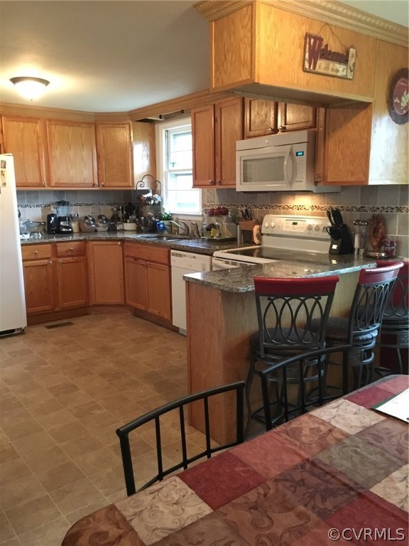 1794 Taylor Road Crozier, VA 23039 - Photo 5 of 20 a kitchen with stainless steel appliances granite countertop a stove a sink and a refrigerator