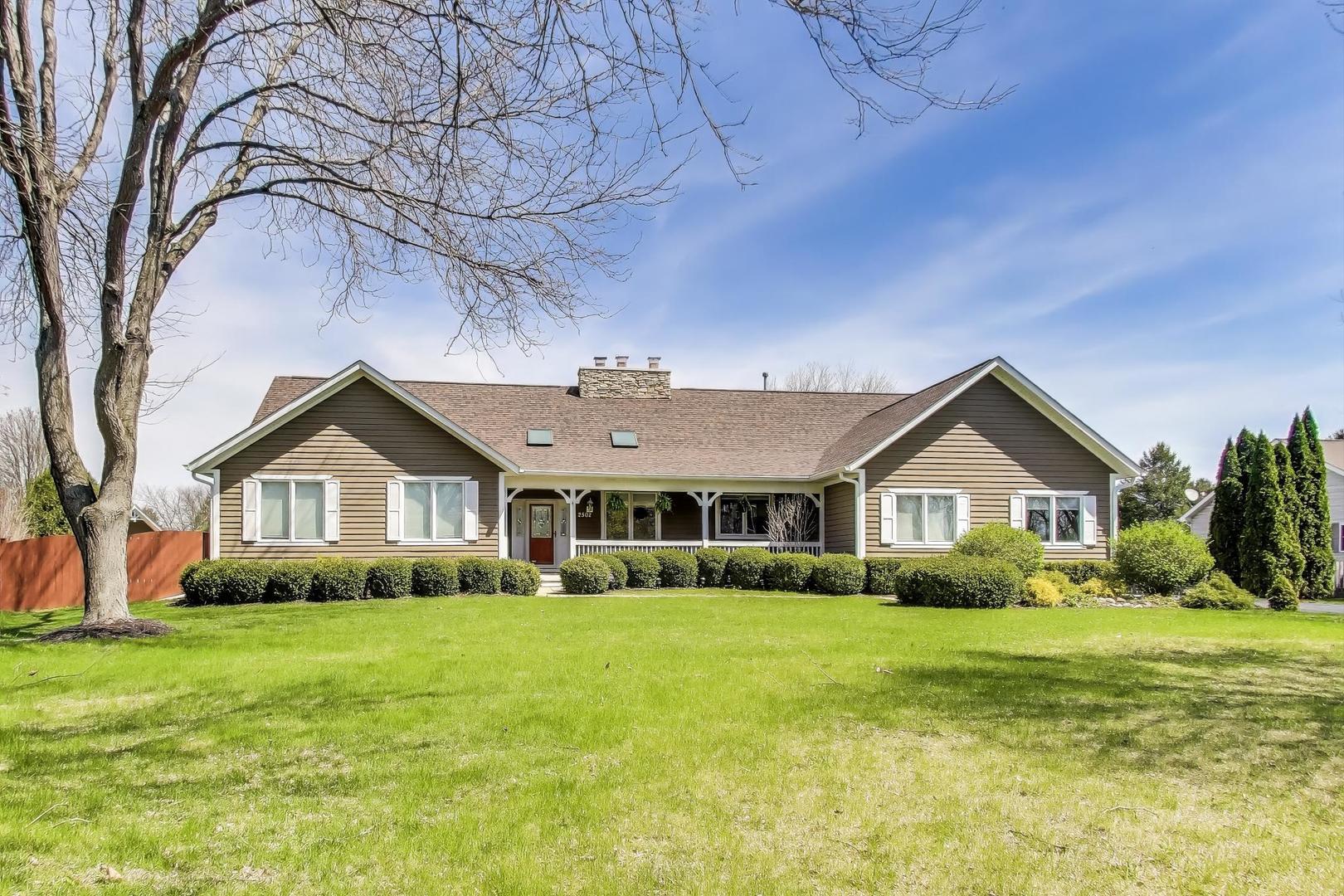 2502 Hidden Trail Spring Grove, IL 60081 - Photo 1 of 51 a front view of house with yard and green space