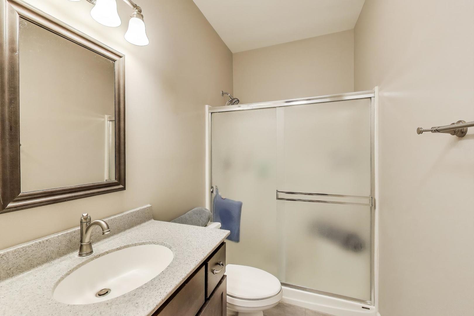 2502 Hidden Trail Spring Grove, IL 60081 - Photo 16 of 51 a bathroom with a sink toilet and shower
