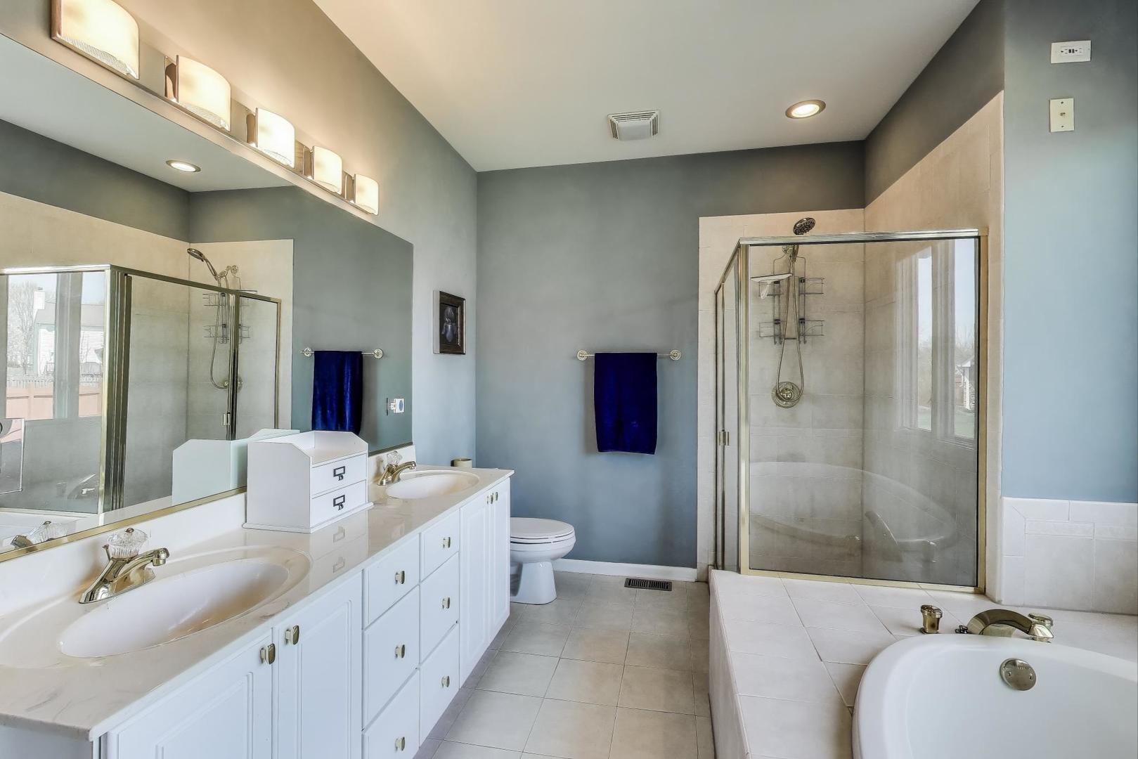 2502 Hidden Trail Spring Grove, IL 60081 - Photo 20 of 51 a bathroom with a double vanity sink mirror and shower