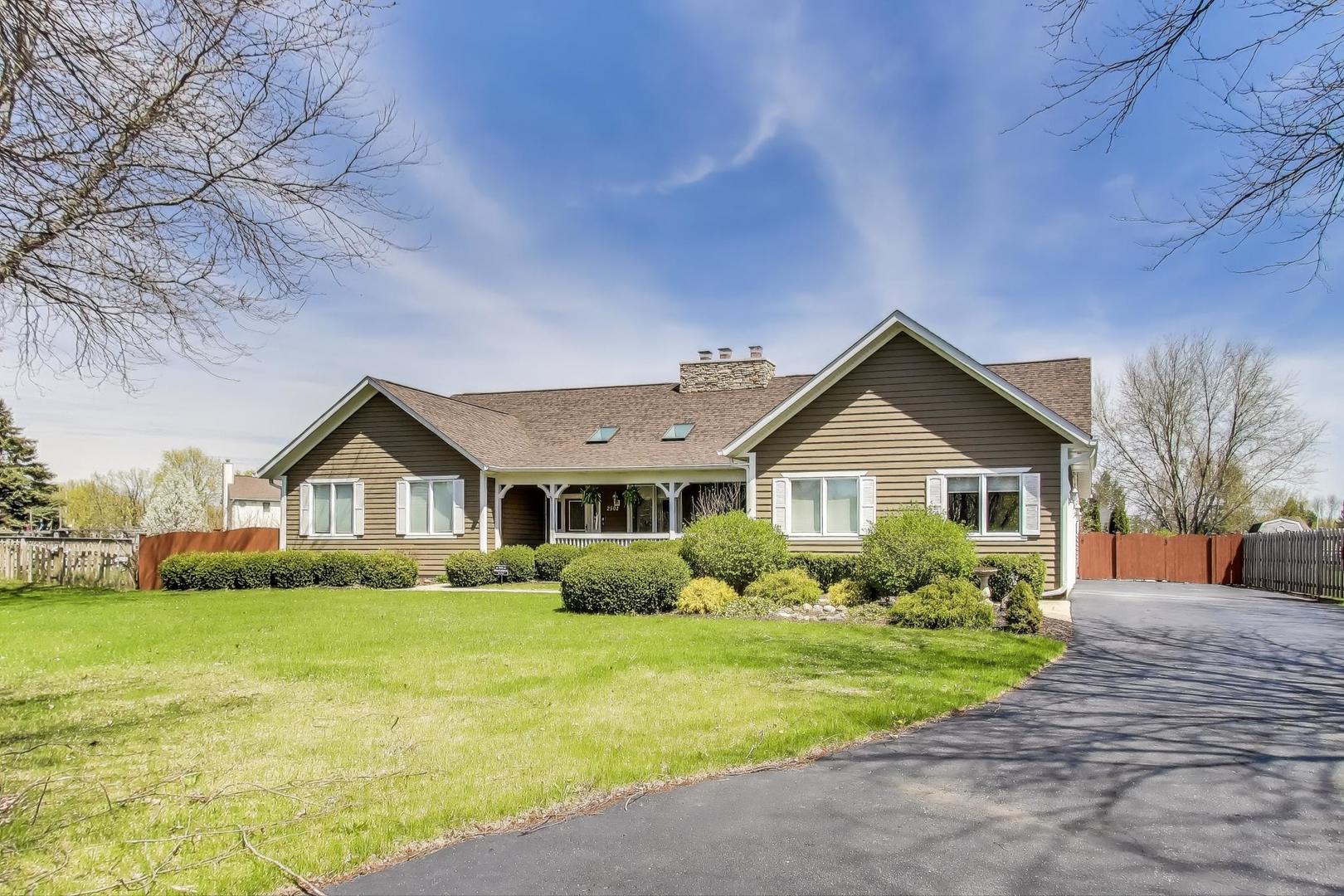 2502 Hidden Trail Spring Grove, IL 60081 - Photo 2 of 51 a front view of house with yard and green space