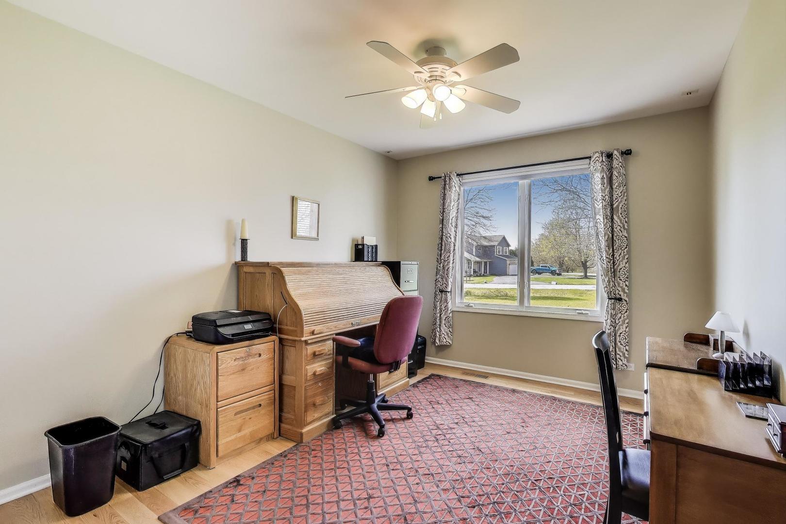 2502 Hidden Trail Spring Grove, IL 60081 - Photo 24 of 51 a view of a workspace with furniture and a window