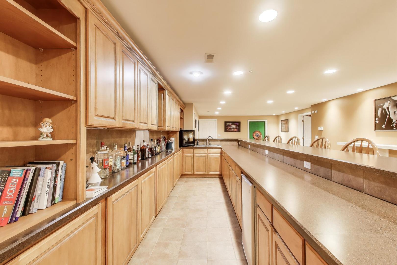 2502 Hidden Trail Spring Grove, IL 60081 - Photo 28 of 51 a view of a kitchen with cabinets and wooden floor