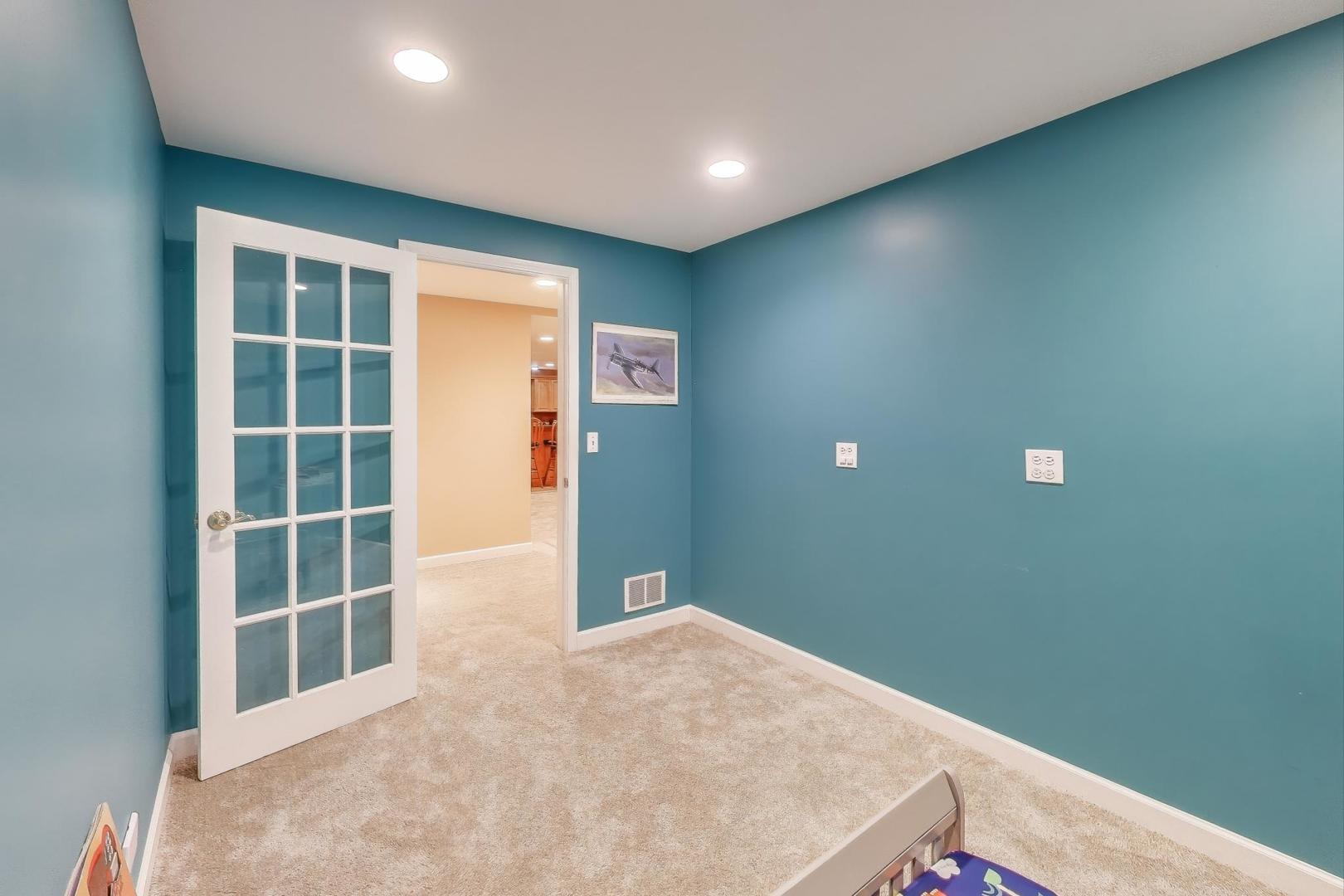 2502 Hidden Trail Spring Grove, IL 60081 - Photo 32 of 51 a view of a big room with windows and cabinetry