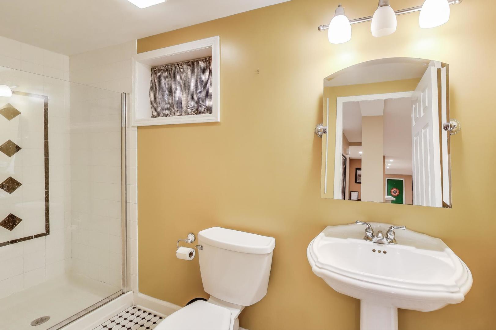 2502 Hidden Trail Spring Grove, IL 60081 - Photo 33 of 51 a bathroom with a toilet sink and mirror