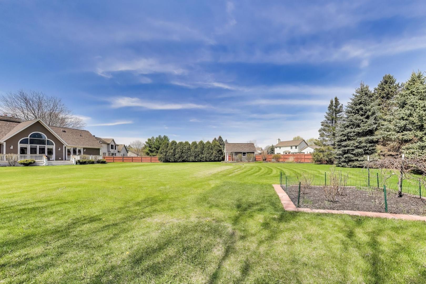 2502 Hidden Trail Spring Grove, IL 60081 - Photo 40 of 51 a view of a house with a big yard plants and large trees