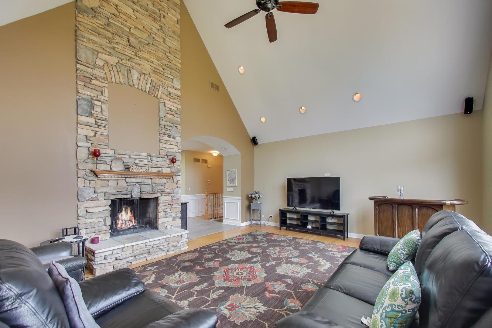 2502 Hidden Trail Spring Grove, IL 60081 - Photo 4 of 51 a living room with furniture and a fireplace
