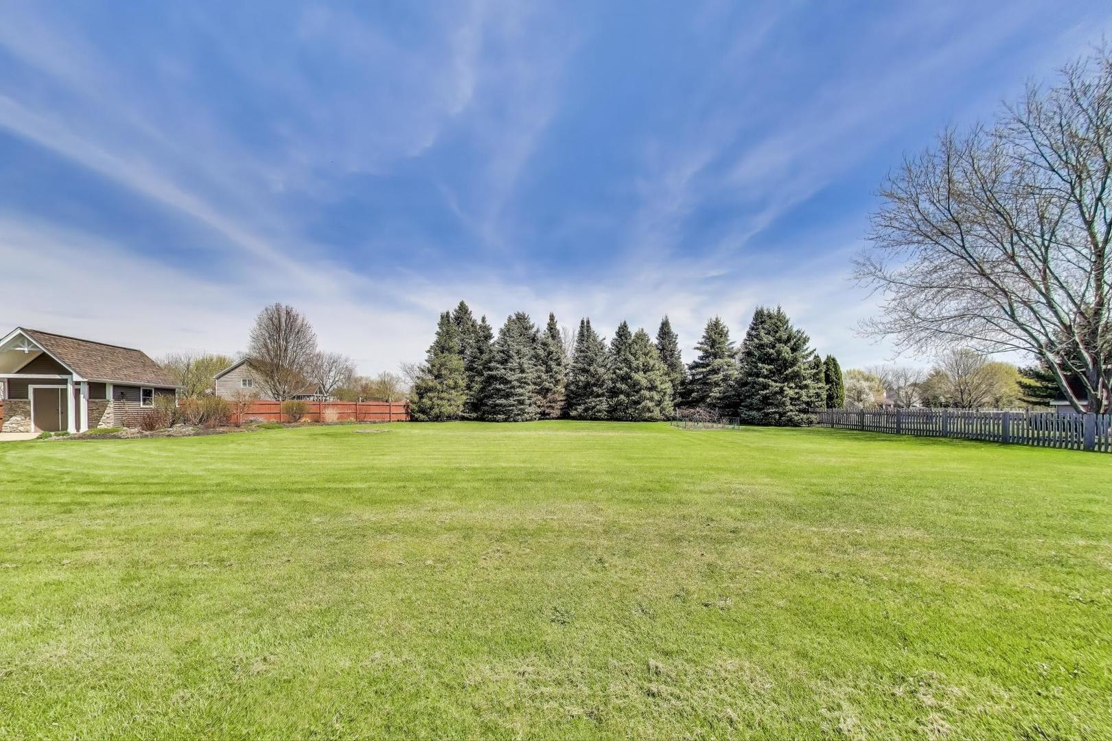 2502 Hidden Trail Spring Grove, IL 60081 - Photo 41 of 51 a view of a green field