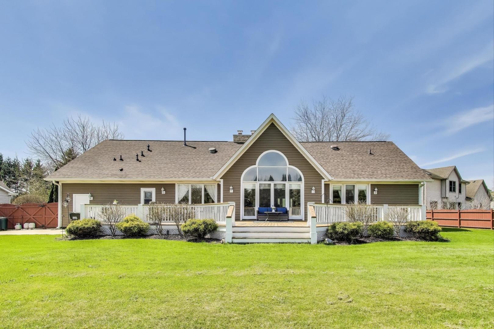 2502 Hidden Trail Spring Grove, IL 60081 - Photo 43 of 51 a front view of a house with a yard