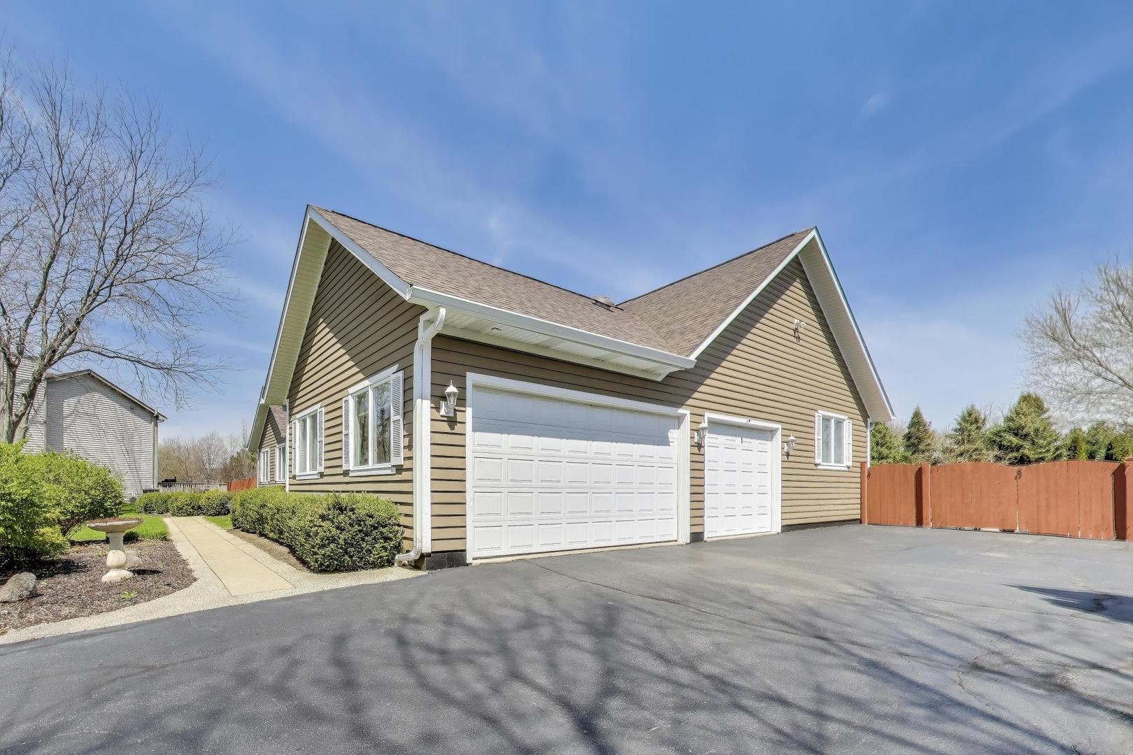 2502 Hidden Trail Spring Grove, IL 60081 - Photo 44 of 51 a view of backyard of house and car parked