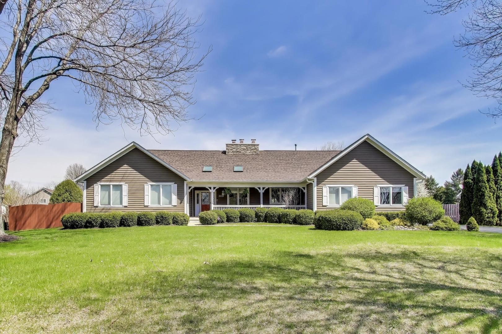 2502 Hidden Trail Spring Grove, IL 60081 - Photo 46 of 51 a front view of a house with a yard