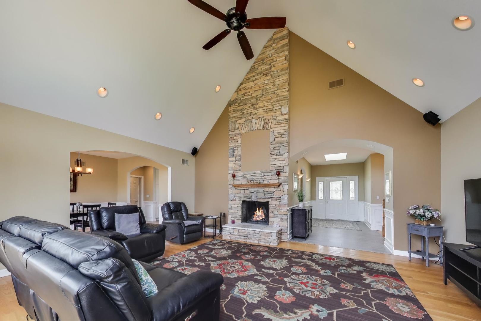 2502 Hidden Trail Spring Grove, IL 60081 - Photo 7 of 51 a living room with furniture and a fireplace
