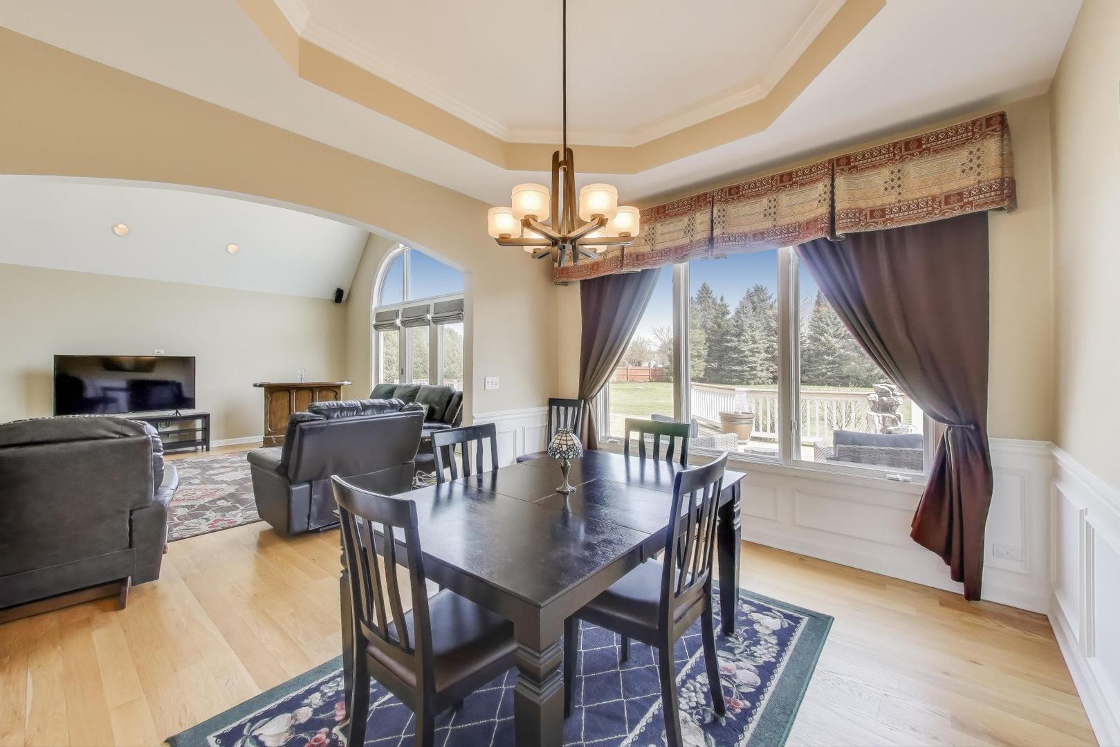 2502 Hidden Trail Spring Grove, IL 60081 - Photo 9 of 51 a view of a dining room with furniture window and outside view