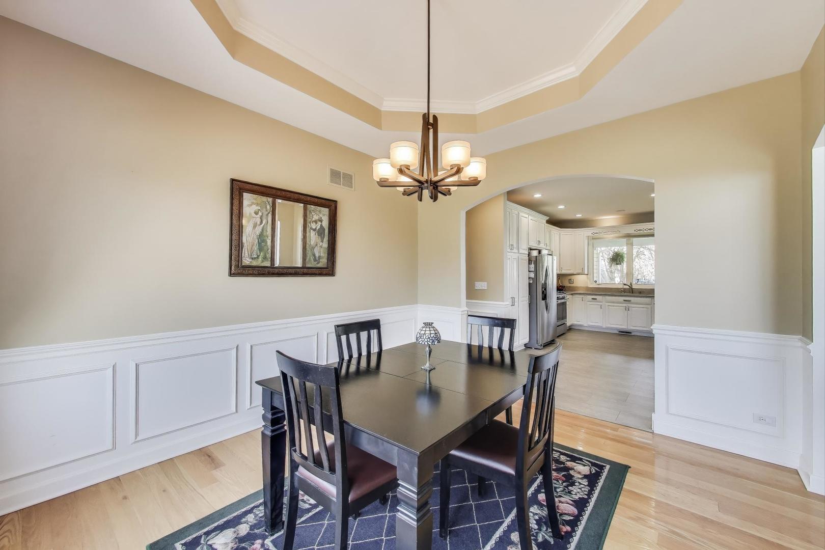 2502 Hidden Trail Spring Grove, IL 60081 - Photo 10 of 51 a view of a dining room with furniture and chandelier