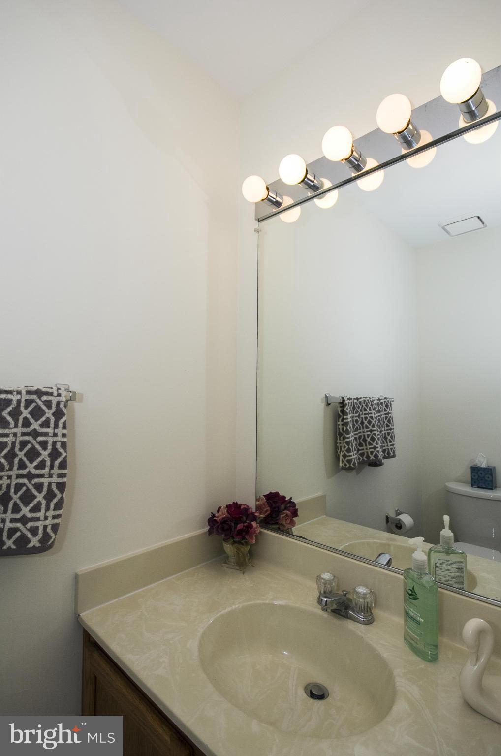 4309 Mispillion Road Baltimore, MD 21236 - Photo 11 of 29 a bathroom with a sink and a mirror