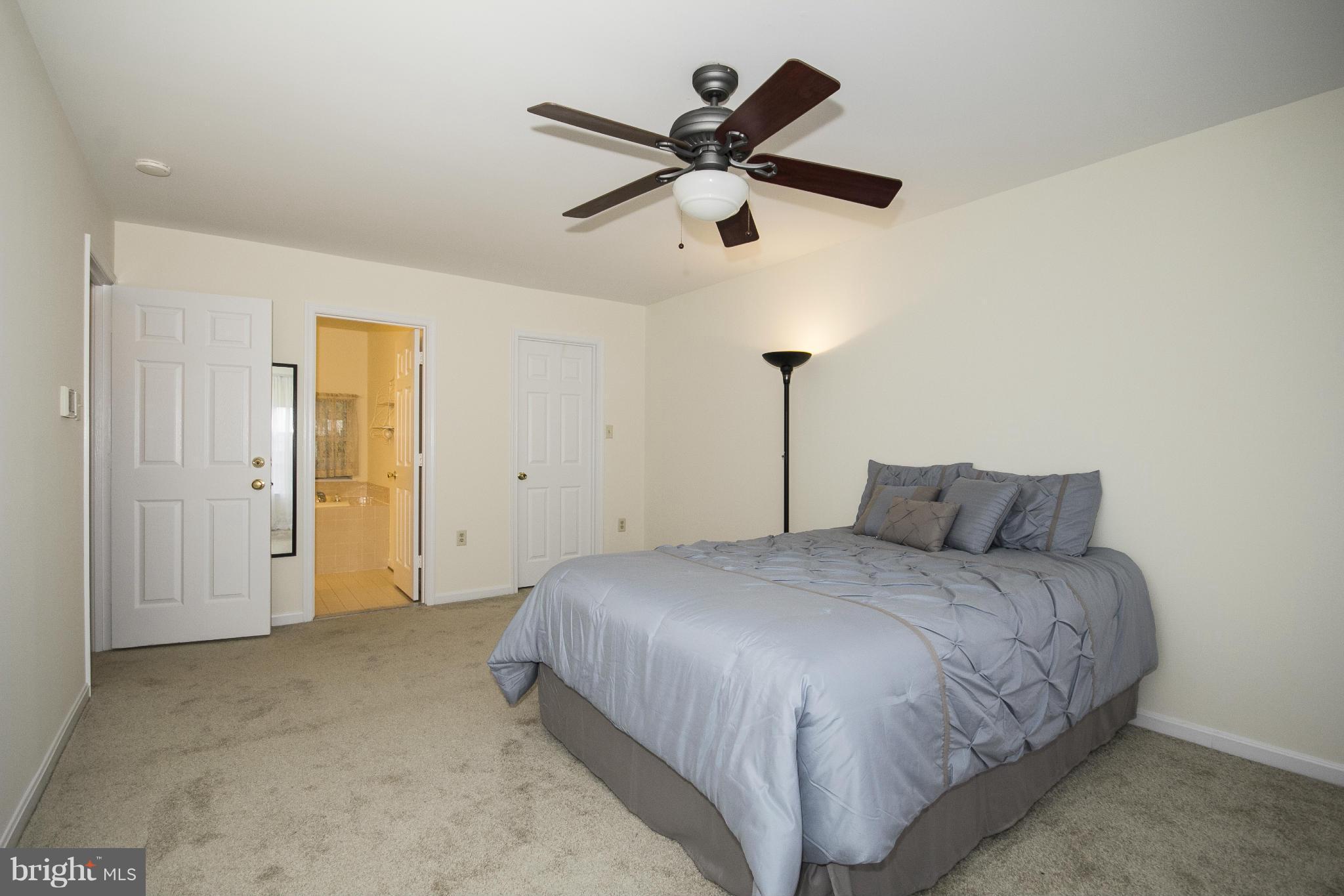 4309 Mispillion Road Baltimore, MD 21236 - Photo 13 of 29 a bedroom with a bed and a ceiling fan