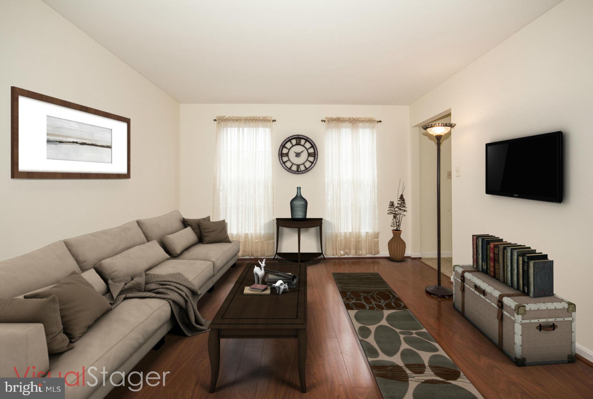 4309 Mispillion Road Baltimore, MD 21236 - Photo 3 of 29 a living room with furniture and a flat screen tv