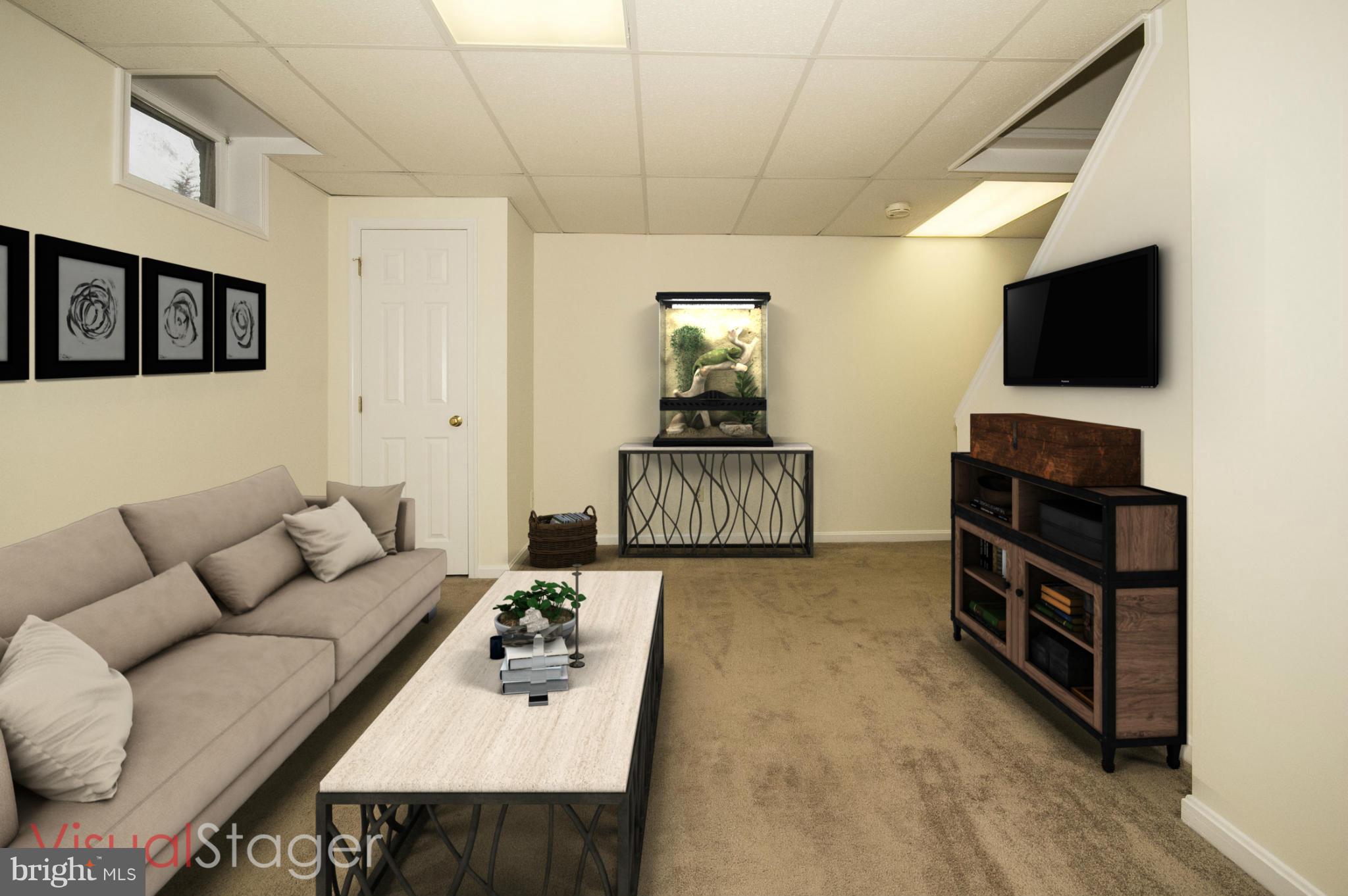 4309 Mispillion Road Baltimore, MD 21236 - Photo 22 of 29 a living room with furniture and a flat screen tv