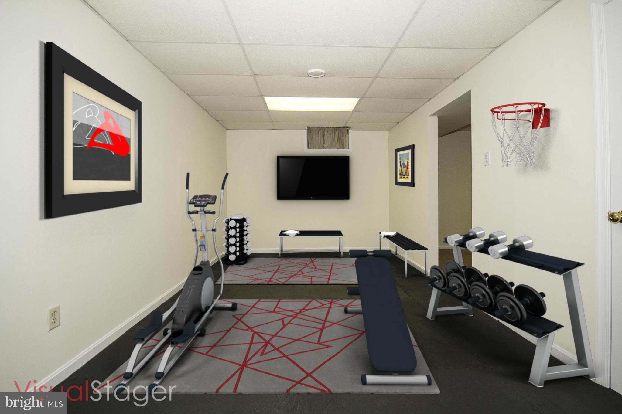 4309 Mispillion Road Baltimore, MD 21236 - Photo 23 of 29 a room with gym equipment and a flat screen tv