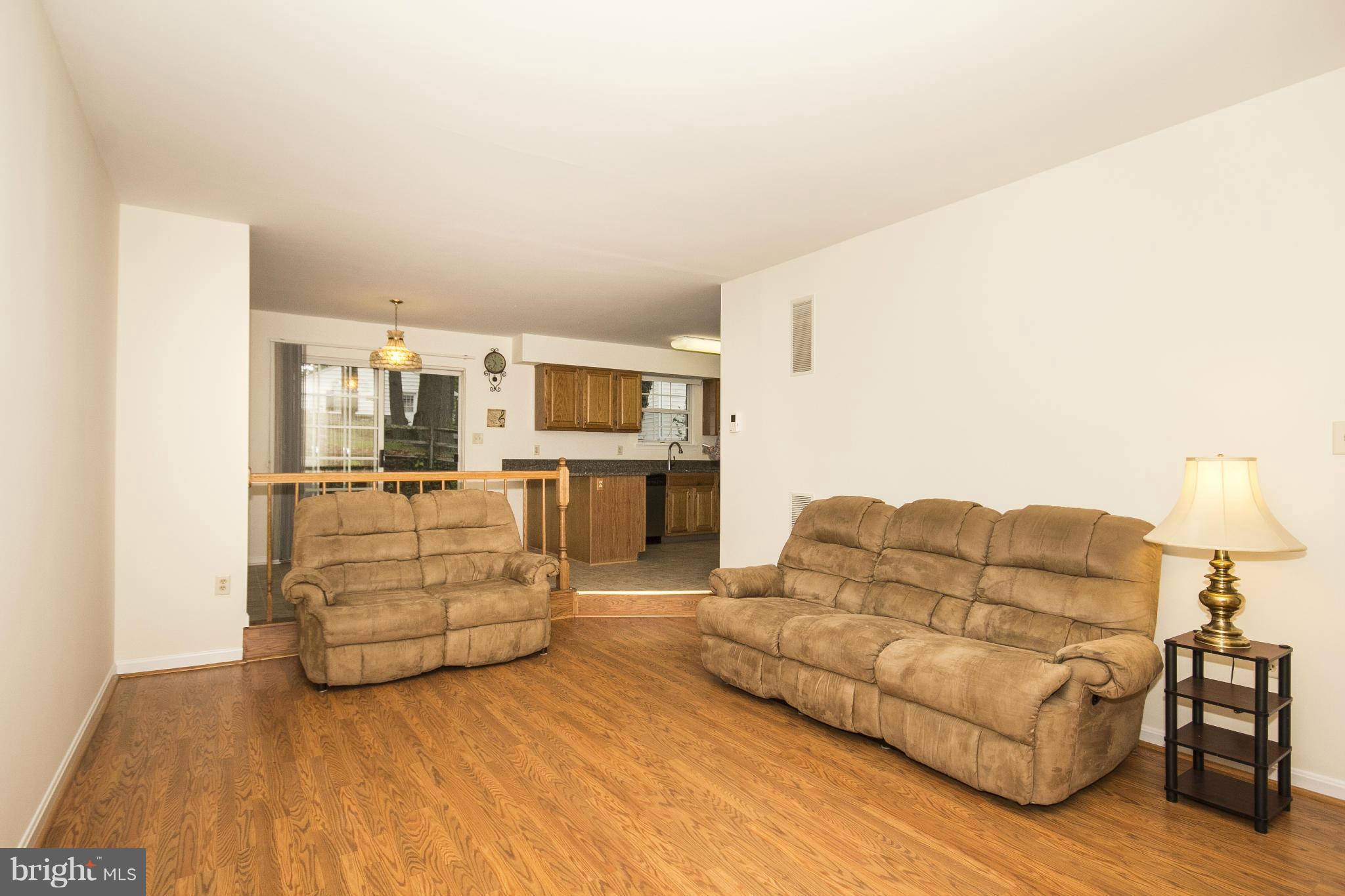 4309 Mispillion Road Baltimore, MD 21236 - Photo 6 of 29 a living room with furniture kitchen view and a couch