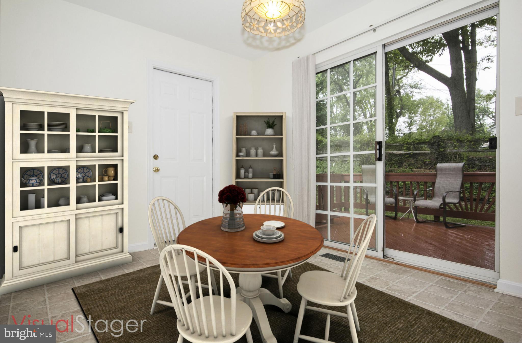 4309 Mispillion Road Baltimore, MD 21236 - Photo 7 of 29 a view of a dining room with furniture large windows and wooden floor