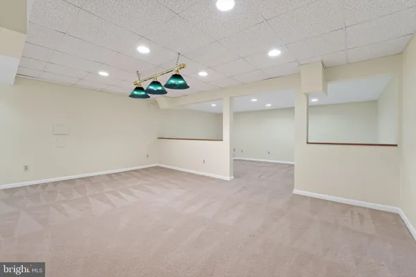 an empty room with a kitchen and a kitchen view