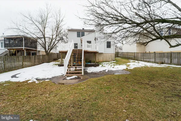 a view of a house with snow in front of it