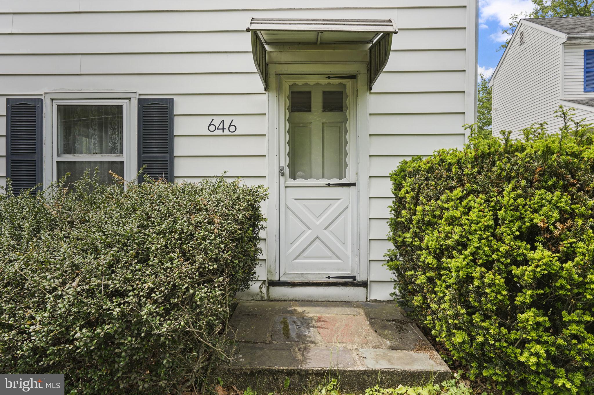646 Ridge Road Monmouth Junction, NJ 08852 - Photo 2 of 47 Charming entryway with lush greenery.