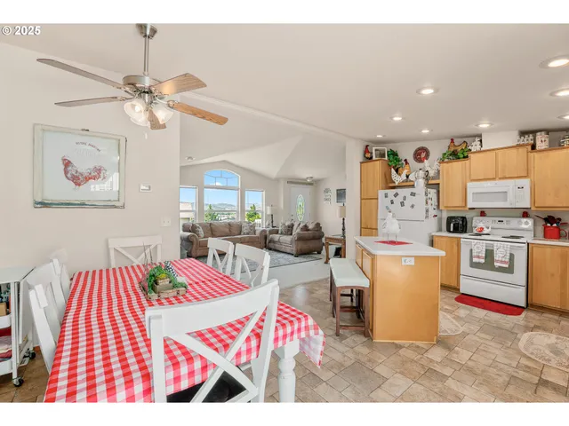 a living room with furniture and kitchen view
