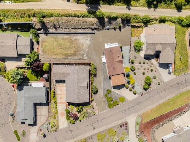 an aerial view of house with a yard
