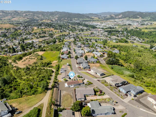 an aerial view of a town with couple of houses