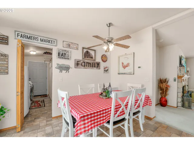 a dining room with furniture and chandelier
