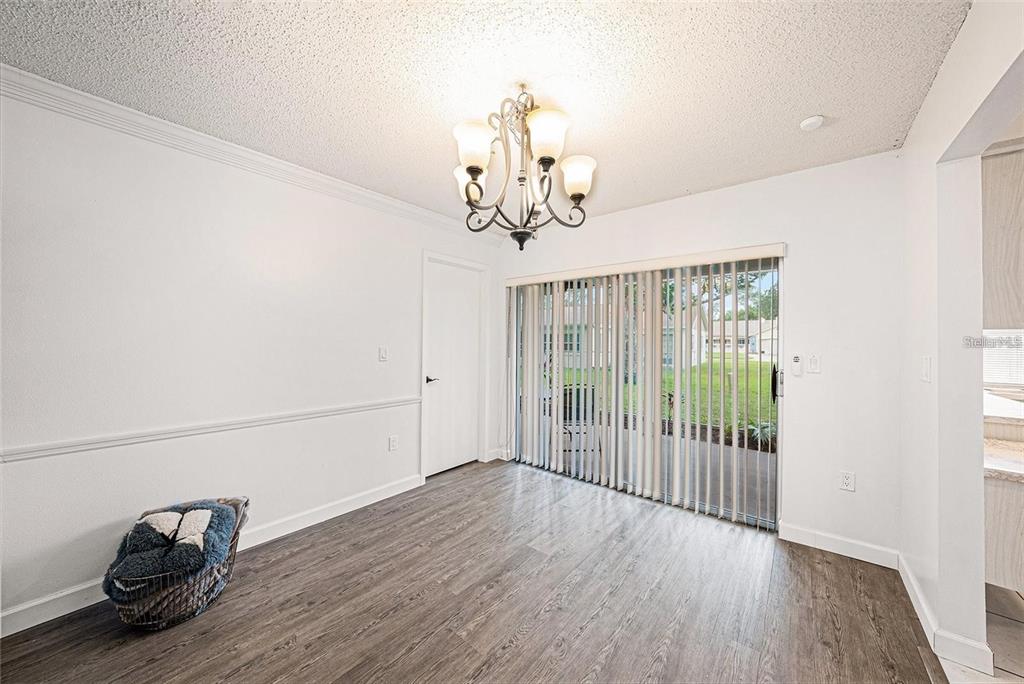 13013 Sawmill Way Hudson, FL 34667 - Photo 19 of 33 a view of a room with wooden floor